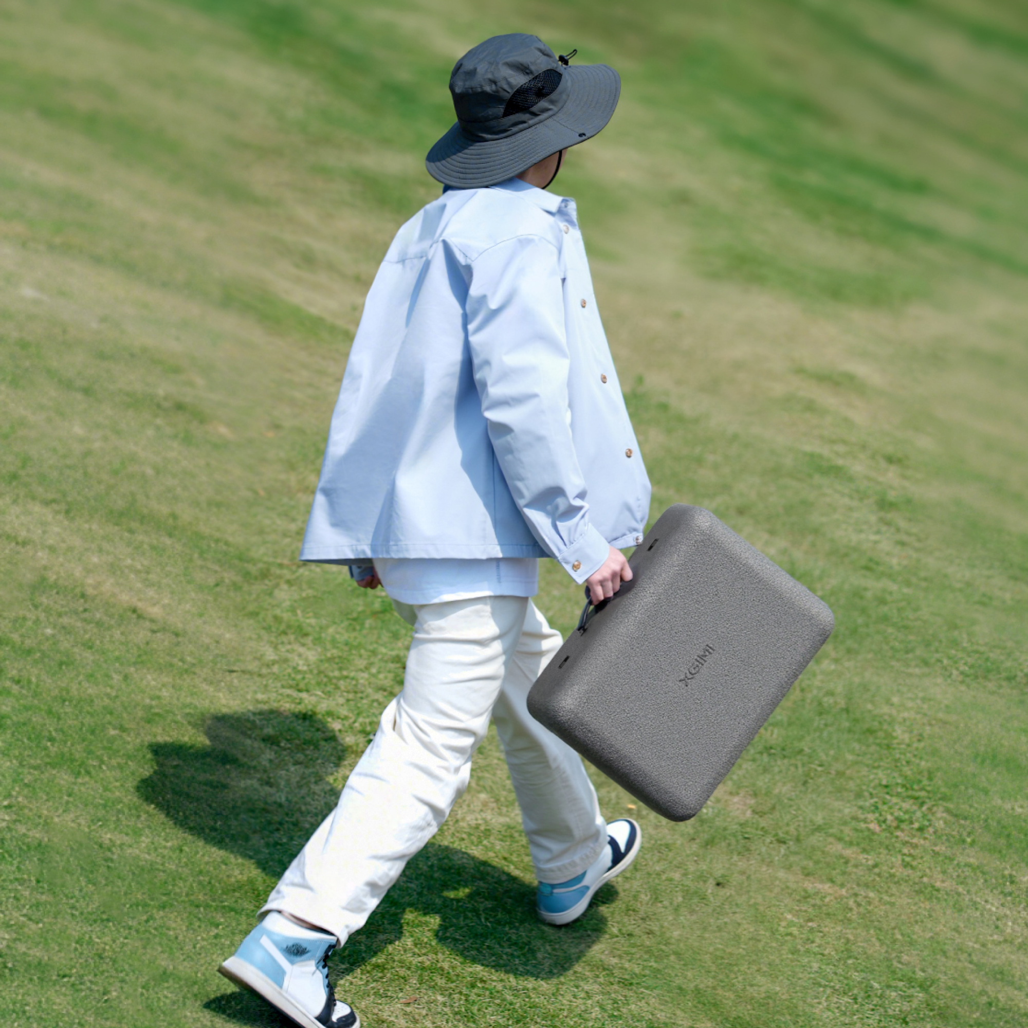 XGIMI MoGo 4 Laser Outdoor Projector Kit for on-the-go streaming: Small laser projector, portable screen, floor stand/Power bank, and creative filters.